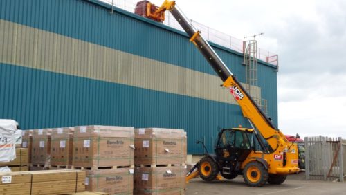 Crates of solar PV being hoisted onto Brighton Energy Coop's 200kWp solar PV plant at Shed 3a, Shoreham Port. Completed 2014.